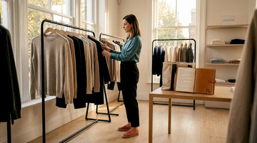 Woman browsing racks during seasonal sale