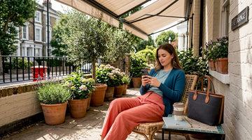Woman in comfortable layered outfit sitting on park bench