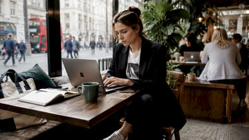 Professional woman dressed down working at office desk