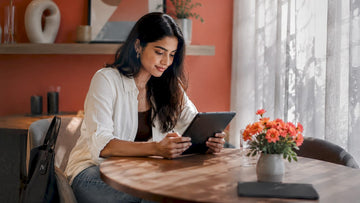 Woman browsing fashion flash sales at home