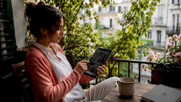 Woman browsing online fashion promotions on tablet
