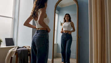 Woman trying flattering crop top in dressing room