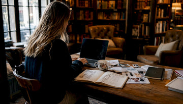 Woman browsing UK fashion sites in café