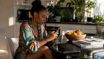 Woman stacking fashion deals online at home