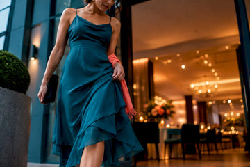 Woman checking an occasion dress hem