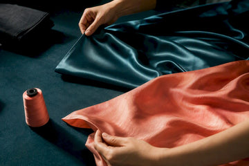 Satin and silk fabrics shown in contrasting folds